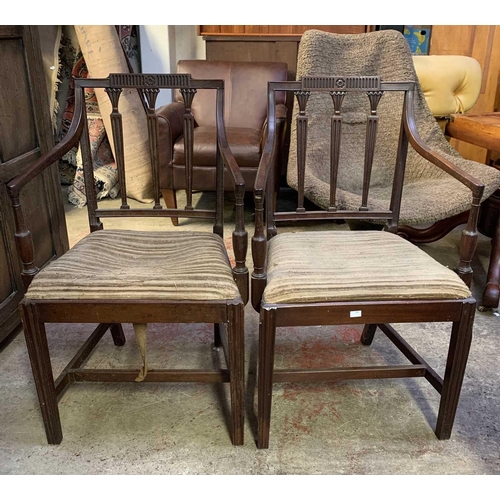 1810 - A set of eight George III mahogany dining chairs, including two carvers, with a triple vertical bar ... 