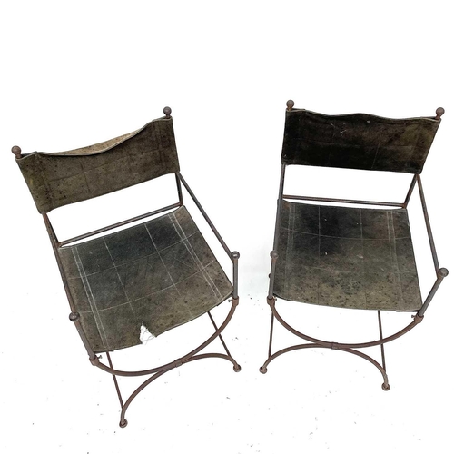 1813 - A pair of wrought Iron 'Bishop's' chairs, mid 20th century, with suede leather backs and slung seats... 