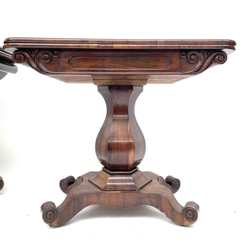 1816 - A pair of early Victorian rosewood tea tables, with fold-over tops on stout hexagonal baluster suppo... 