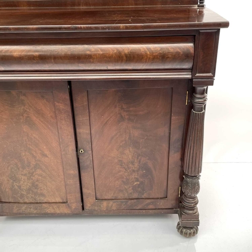 1817 - A William IV mahogany chiffonier, the raised back fitted two shelves above a long frieze drawer and ... 