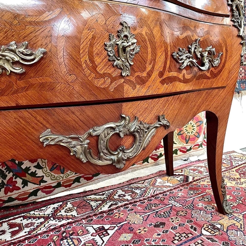 1818 - A French Louis XVI style kingwood, crossbanded and inlaid commode, circa 1900, of bombe form, with m... 