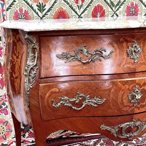 1818 - A French Louis XVI style kingwood, crossbanded and inlaid commode, circa 1900, of bombe form, with m... 