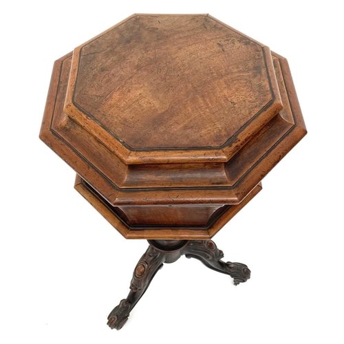 1820 - A Victorian walnut octagonal teapoy, the hinged top revealing two lidded containers and recesses for... 