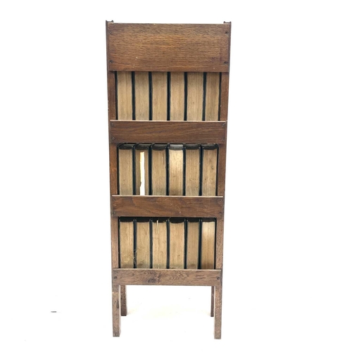 1825 - An oak narrow bookcase, early 20th century, containing 18 volumes of the Charles Dickens library, he... 