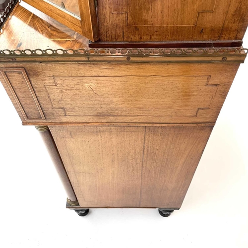 1828 - A Regency rosewood and kingwood banded secretaire cabinet, the upper part with two glazed doors with... 