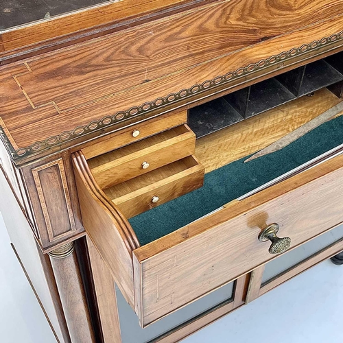 1828 - A Regency rosewood and kingwood banded secretaire cabinet, the upper part with two glazed doors with... 