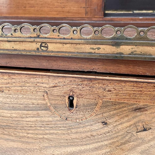 1828 - A Regency rosewood and kingwood banded secretaire cabinet, the upper part with two glazed doors with... 