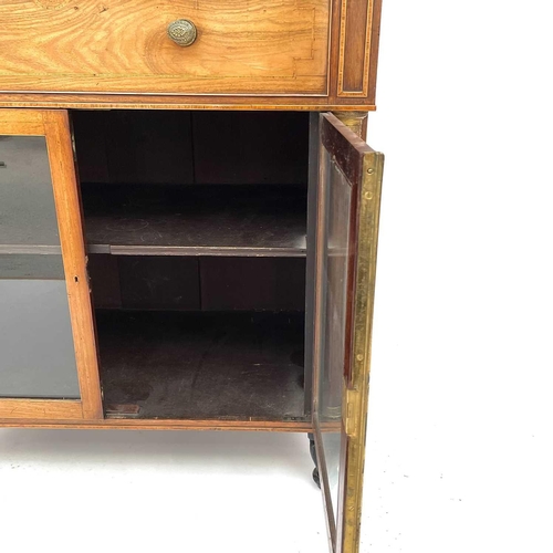 1828 - A Regency rosewood and kingwood banded secretaire cabinet, the upper part with two glazed doors with... 