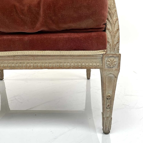 1831 - A French Loius XV style beech wing armchair, circa 1900, with leaf carved decoration and lappet arm ... 