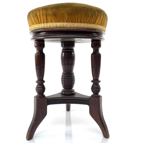 1833 - A Victorian walnut revolving piano stool, height 49cm, diameter 32cm.