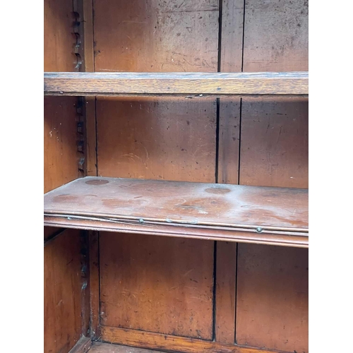 1848 - A Victorian mahogany two-part cabinet, of small proportions, the upper part with two glazed doors, t... 