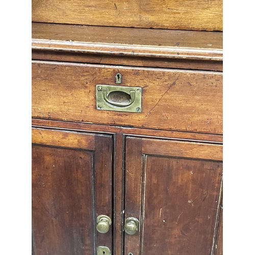 1848 - A Victorian mahogany two-part cabinet, of small proportions, the upper part with two glazed doors, t... 