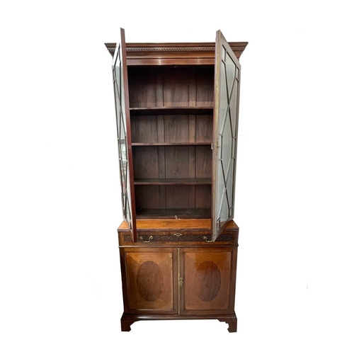 1849 - A late Victorian mahogany cabinet bookcase, in the Georgian taste, with a glazed upper part and a lo... 