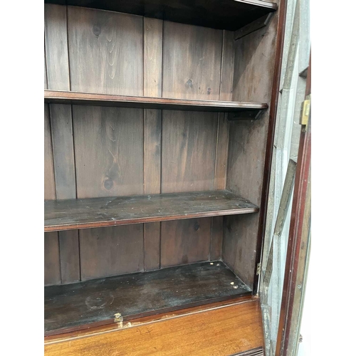 1849 - A late Victorian mahogany cabinet bookcase, in the Georgian taste, with a glazed upper part and a lo... 