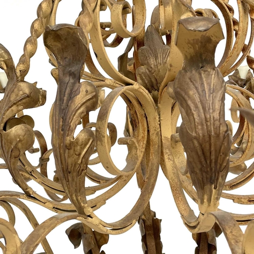 1852 - A substantial Continental yellow and gilt painted wrought iron chandelier, with twist and foliate ap... 