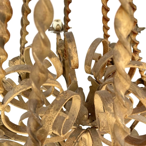 1852 - A substantial Continental yellow and gilt painted wrought iron chandelier, with twist and foliate ap... 