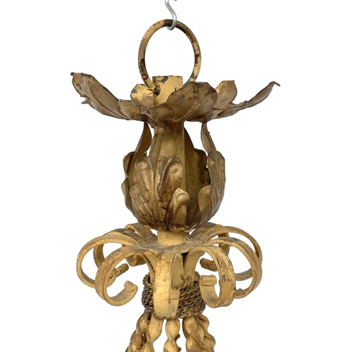 1852 - A substantial Continental yellow and gilt painted wrought iron chandelier, with twist and foliate ap... 