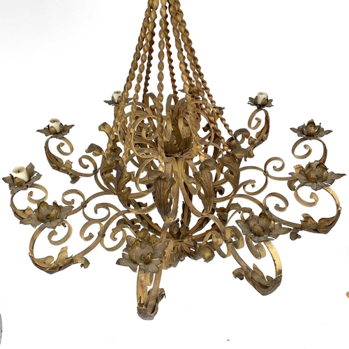 1852 - A substantial Continental yellow and gilt painted wrought iron chandelier, with twist and foliate ap... 