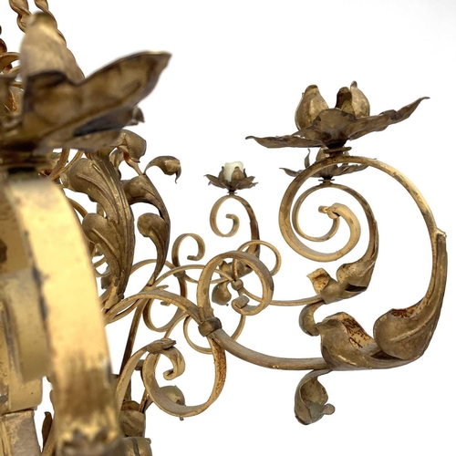 1852 - A substantial Continental yellow and gilt painted wrought iron chandelier, with twist and foliate ap... 