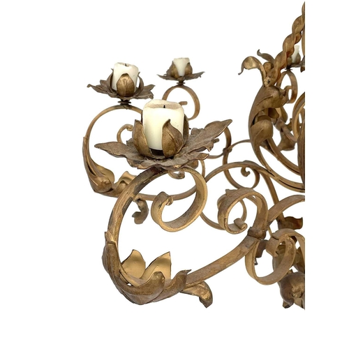 1852 - A substantial Continental yellow and gilt painted wrought iron chandelier, with twist and foliate ap... 