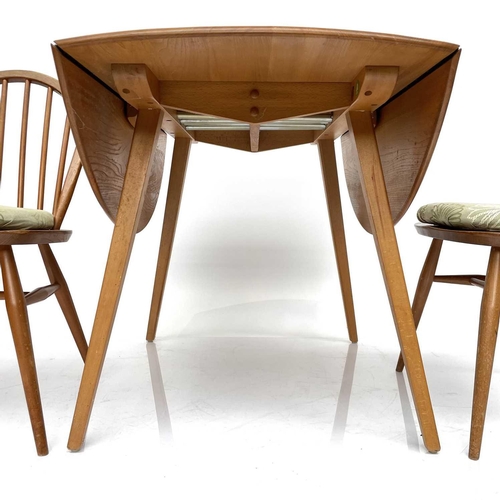 1853 - An Ercol light elm twin flap dining table, on splay square legs, height 72cm, width 112cm, depth 128... 