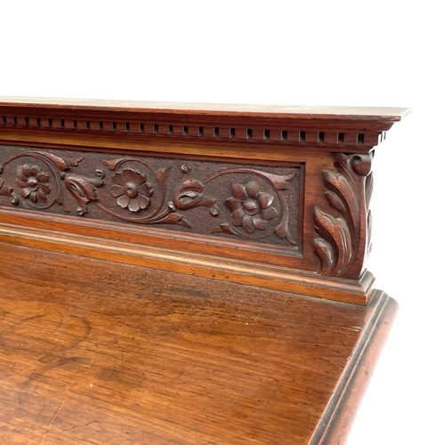 1860 - A late Victorian walnut buffet, with carved raised back and two carved doors below, height 125cm, wi... 