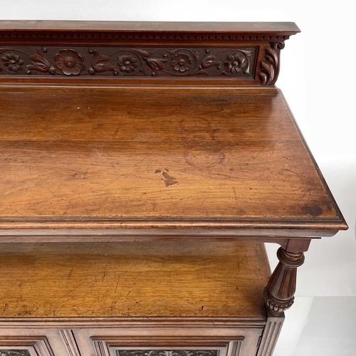 1860 - A late Victorian walnut buffet, with carved raised back and two carved doors below, height 125cm, wi... 