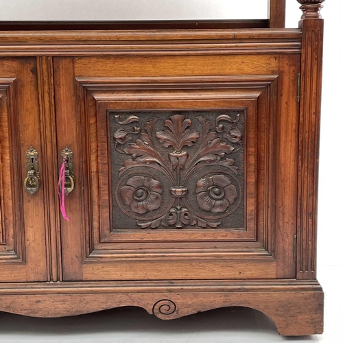 1860 - A late Victorian walnut buffet, with carved raised back and two carved doors below, height 125cm, wi... 