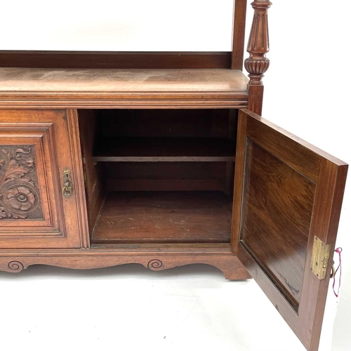 1860 - A late Victorian walnut buffet, with carved raised back and two carved doors below, height 125cm, wi... 