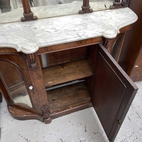 1863 - A Victorian walnut mirror back sideboard, with marble top above three mirrored doors, height 169cm, ... 