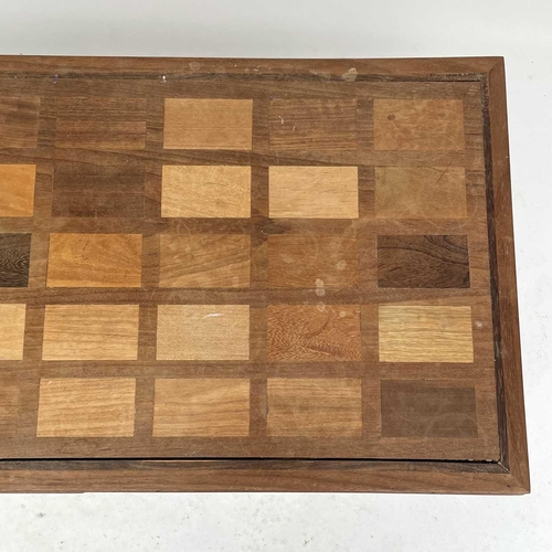 1864 - A Ghanian hardwood coffee table, circa 1960s, the rectangular top inlaid with forty African hardwood... 