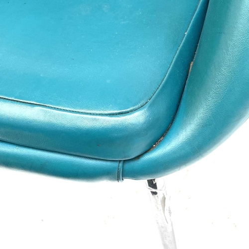 1865 - A Du-al armchair, with turquoise vinyl upholstery, raised on chrome legs, labelled Du-al Harrow Engl... 