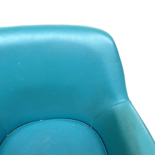 1865 - A Du-al armchair, with turquoise vinyl upholstery, raised on chrome legs, labelled Du-al Harrow Engl... 