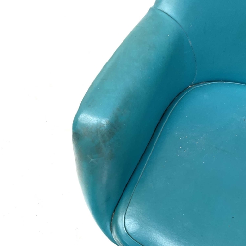 1865 - A Du-al armchair, with turquoise vinyl upholstery, raised on chrome legs, labelled Du-al Harrow Engl... 