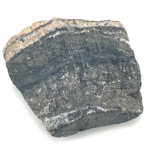 187 - A massive cassiterite from South Crofty Mine Redruth, length 15cm.