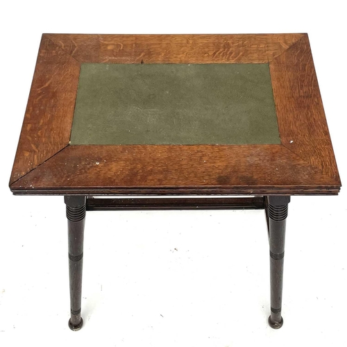 1870 - An Arts and Crafts oak card or games table, in the Liberty style, with fold-top on turned splay legs... 