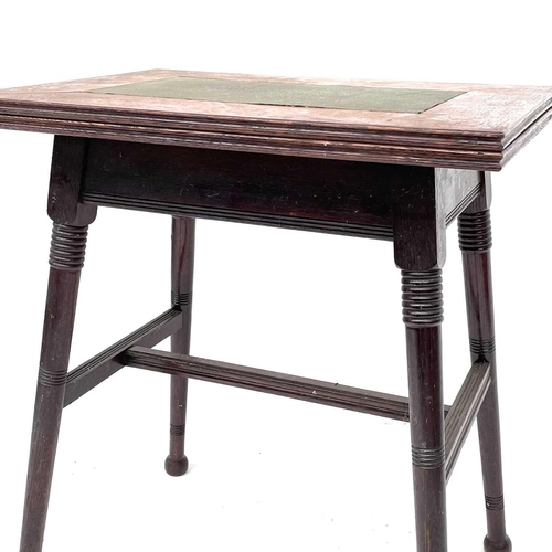 1870 - An Arts and Crafts oak card or games table, in the Liberty style, with fold-top on turned splay legs... 