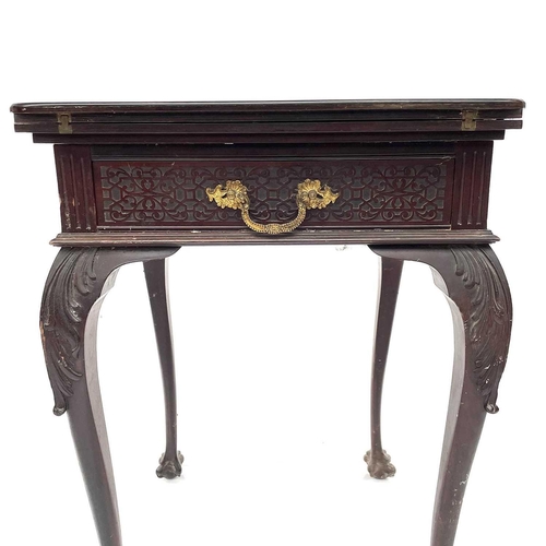 1872 - A James Shoolbred & Co mahogany envelope fold top card table, with baised top and counter dishes, fi... 