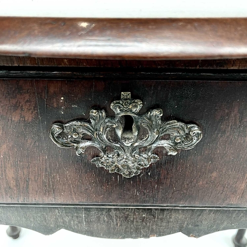 1873 - An early 18th century mahogany side table, the rectangular top with shaped edge above a long drawer ... 