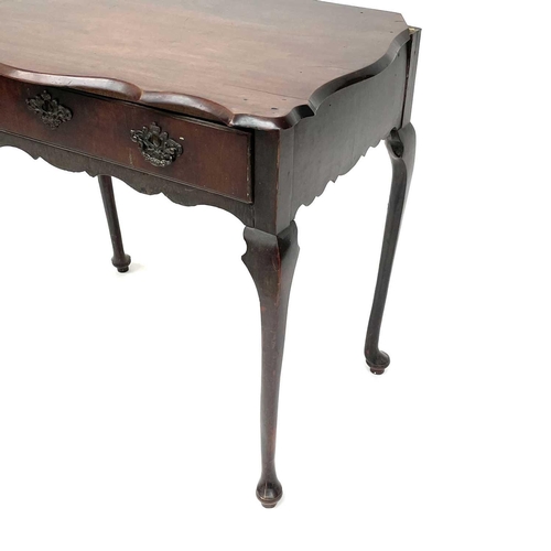 1873 - An early 18th century mahogany side table, the rectangular top with shaped edge above a long drawer ... 