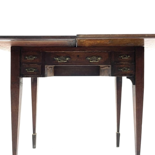 1875 - A late Victorian walnut and inlaid games and work table, stamped Jas Shoolbred & Co, with swivel top... 