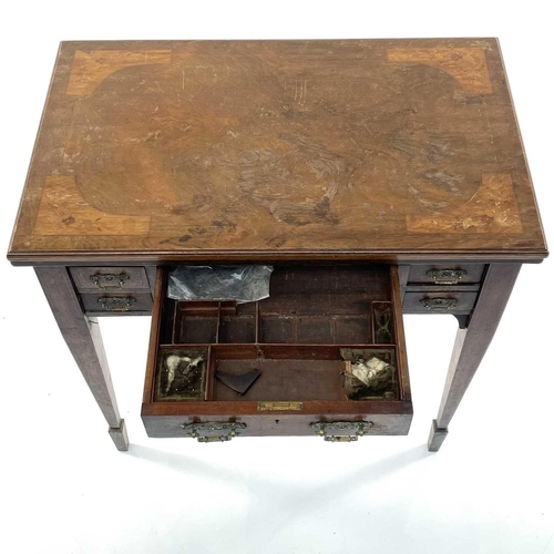 1875 - A late Victorian walnut and inlaid games and work table, stamped Jas Shoolbred & Co, with swivel top... 