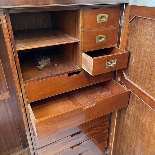 1876 - A 19th century mahogany wardrobe, with arcaded cornice above two panel doors, one enclosing hanging ... 