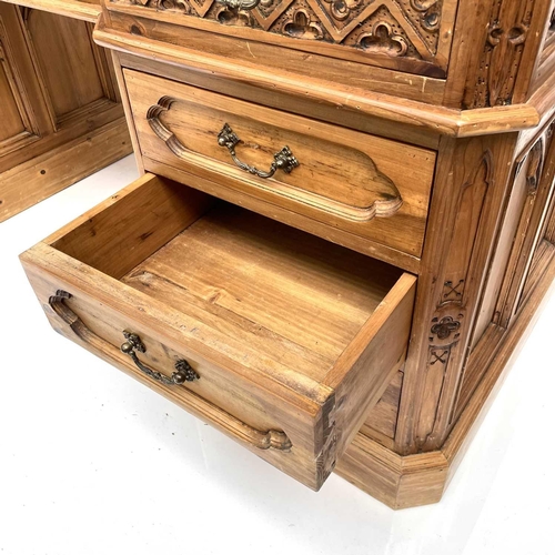 1878 - A pine partner's pedestal desk, 20th century, the upper drawers with Gothic carved fronts, and with ... 