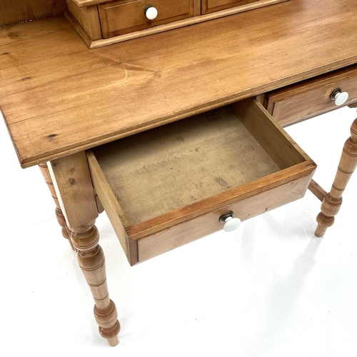 1879 - An Edwardian pine dressing table, with a swing mirror and four drawers on turned legs, height 159cm,... 