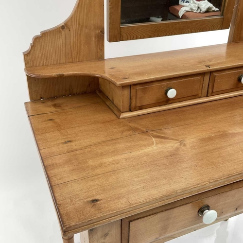 1879 - An Edwardian pine dressing table, with a swing mirror and four drawers on turned legs, height 159cm,... 