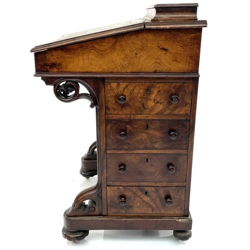 1883 - A Victorian walnut and inlaid Davenport, fitted four real and four dummy drawers, with a rising back... 