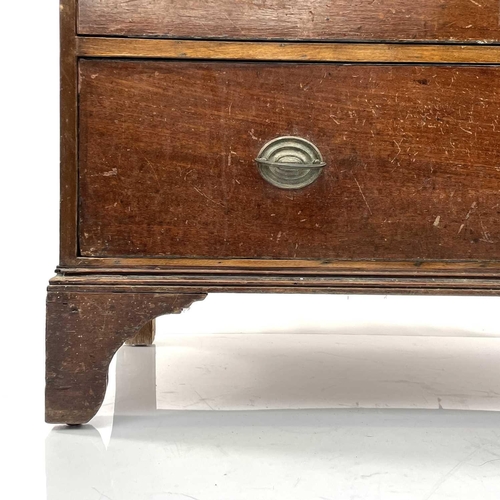 1885 - A late George III oak and mahogany chest of two short and three long drawers, on bracket feet, heigh... 