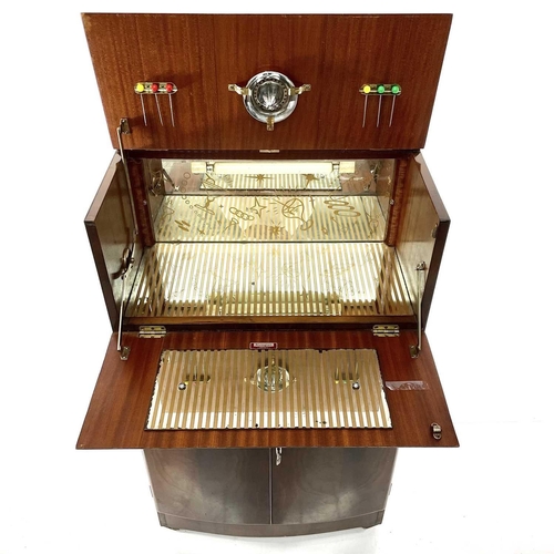 1888 - A Rivington walnut veneer cocktail cabinet with mirrored interior retaining the original lemon squee... 