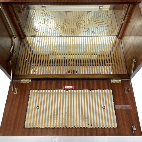 1888 - A Rivington walnut veneer cocktail cabinet with mirrored interior retaining the original lemon squee... 